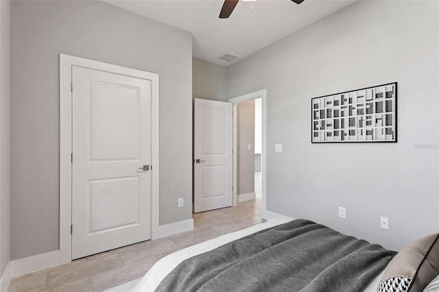 bedroom with ceiling fan, visible vents, and baseboards