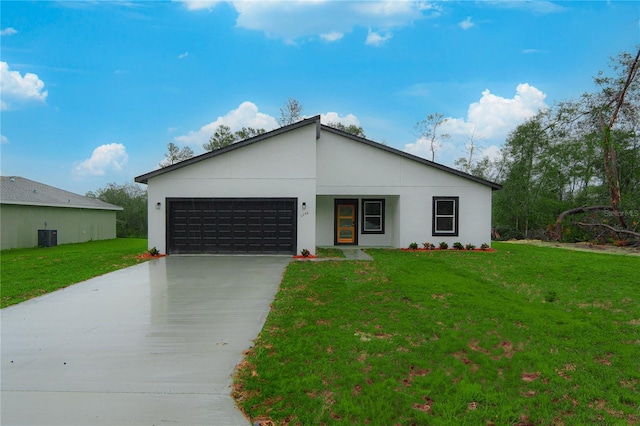 single story home with a front yard, cooling unit, driveway, and an attached garage