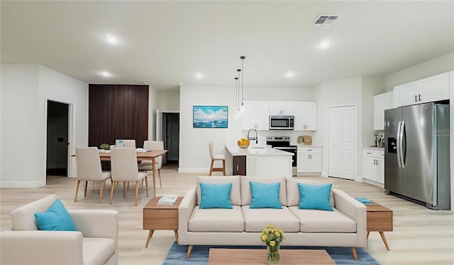 2246 SW 167th Pl, Ocala, FL 34475 - living area featuring light wood-type flooring and recessed lighting