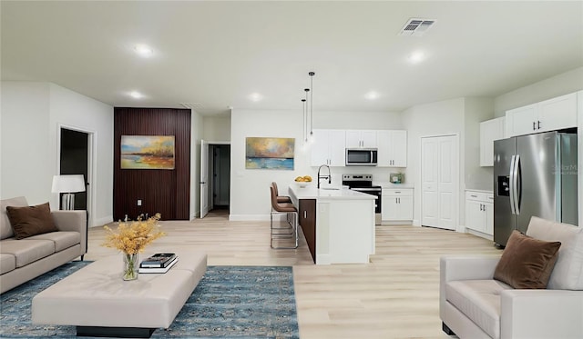2246 SW 167th Pl, Ocala, FL 34475 - living area featuring light wood finished floors and recessed lighting