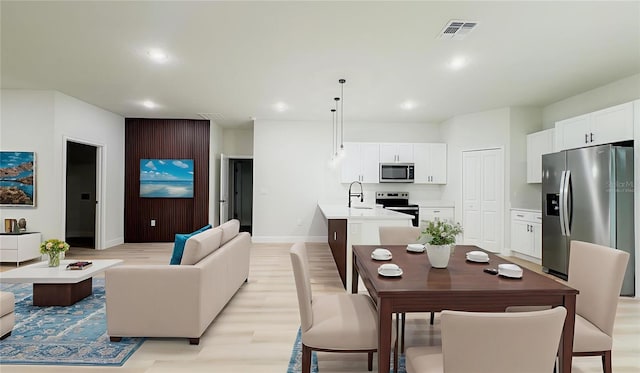 2246 SW 167th Pl, Ocala, FL 34475 - living area featuring light wood finished floors and recessed lighting