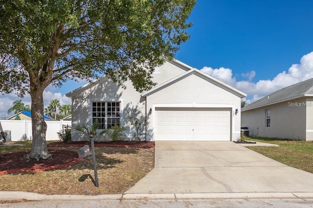 ranch-style home featuring a garage, concrete driveway, fence, and stucco siding