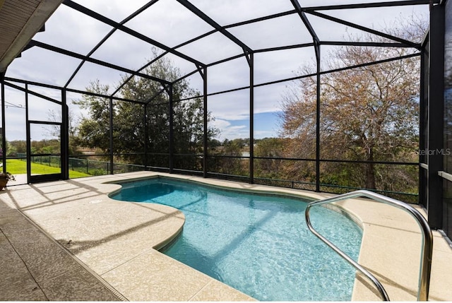 pool with a patio and a lanai