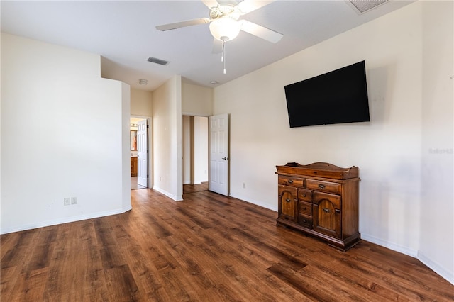 unfurnished living room featuring visible vents, a ceiling fan, baseboards, and wood finished floors