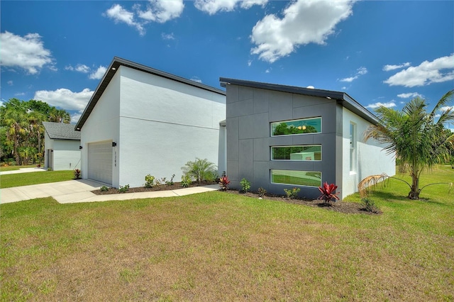 view of outdoor structure featuring driveway and an attached garage