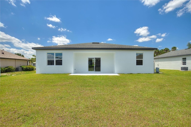 back of house featuring a yard, a patio area, and cooling unit