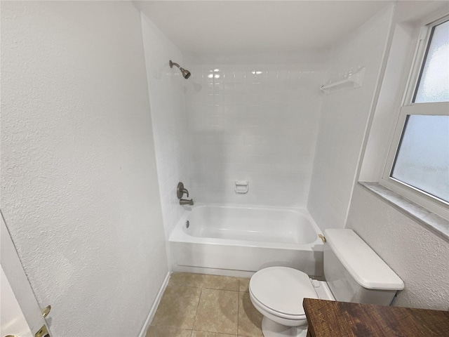 bathroom featuring baseboards, a textured wall, toilet, shower / tub combination, and tile patterned floors