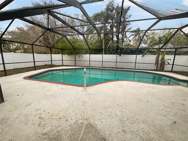 view of pool featuring a patio, a fenced backyard, a fenced in pool, and a lanai