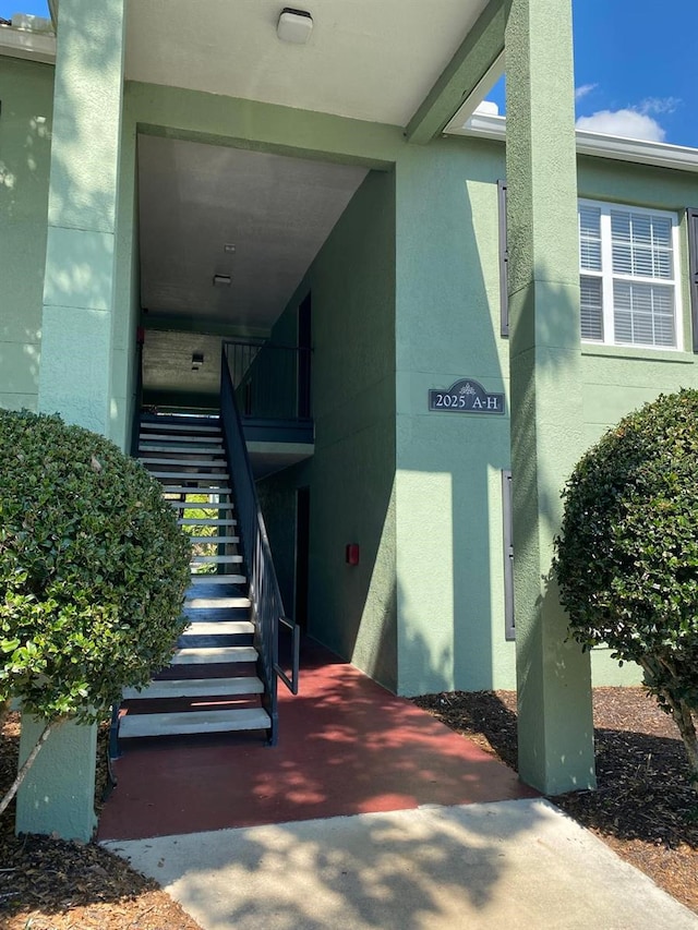 view of exterior entry with stucco siding