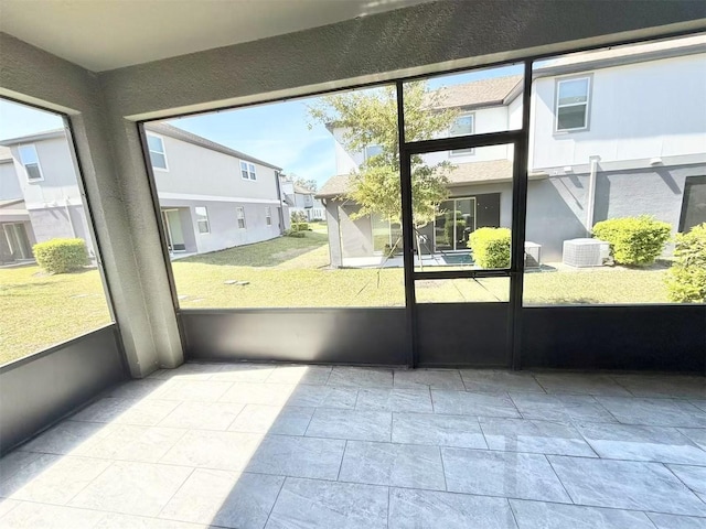 unfurnished sunroom featuring a residential view