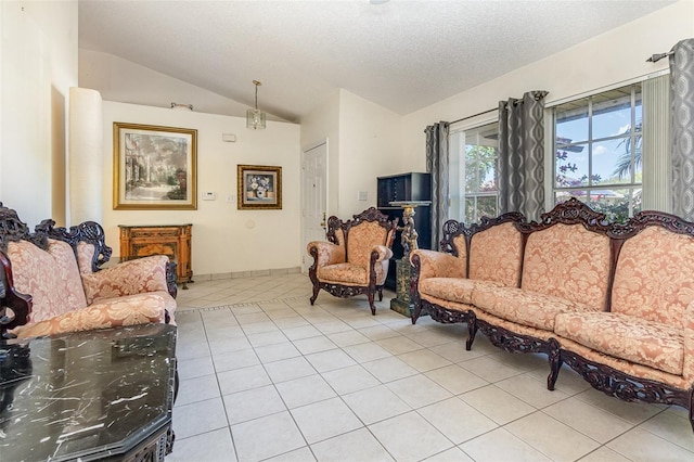 living room with tile patterned flooring, vaulted ceiling, and a textured ceiling