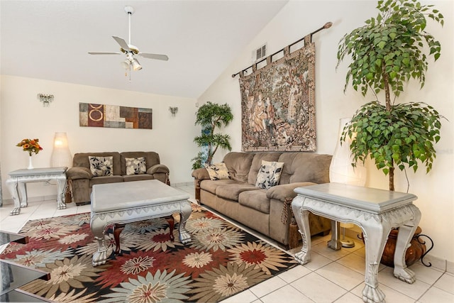 living area featuring lofted ceiling, tile patterned flooring, visible vents, and ceiling fan