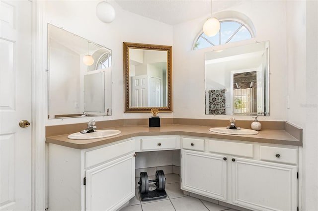 full bathroom with tile patterned flooring, a sink, and a healthy amount of sunlight