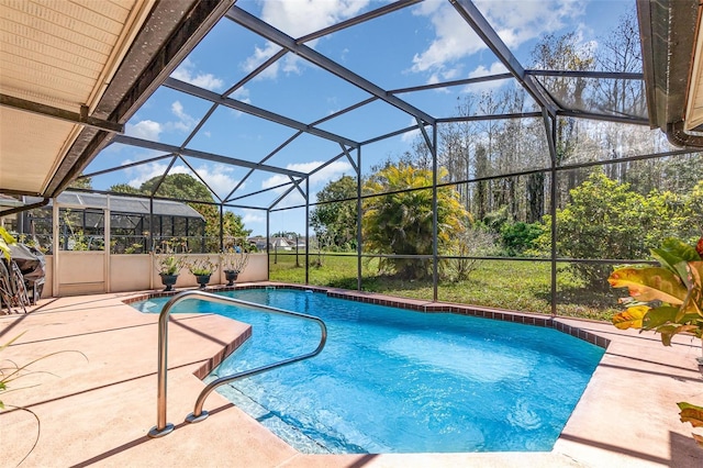 outdoor pool with a patio area and glass enclosure