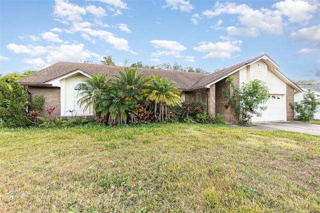 314 Silk Oak Dr, Kissimmee, FL 34743 - view of front of house with a front yard, concrete driveway, an attached garage, brick siding, and a shingled roof