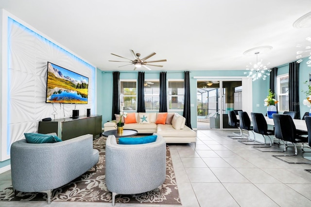 interior space with ceiling fan with notable chandelier and light tile patterned flooring