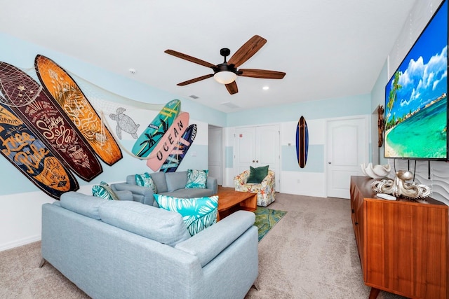 living area featuring a ceiling fan, light carpet, and visible vents