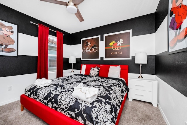 carpeted bedroom featuring a ceiling fan and baseboards