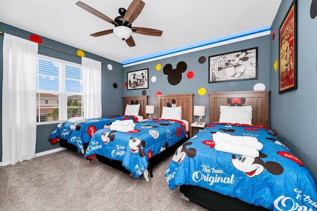 bedroom with carpet floors, baseboards, and a ceiling fan