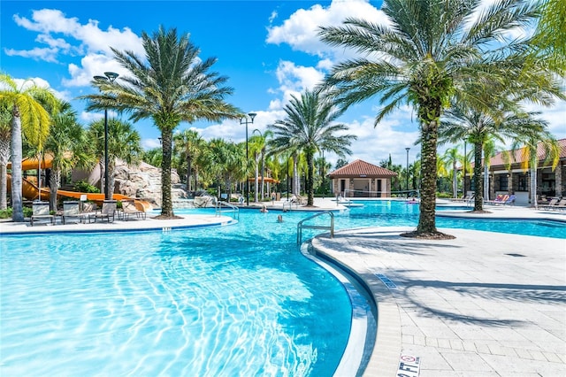 community pool with a patio area and a gazebo