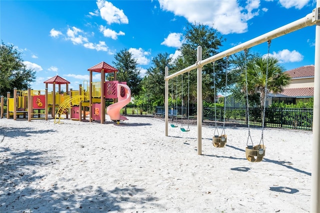 community jungle gym featuring fence