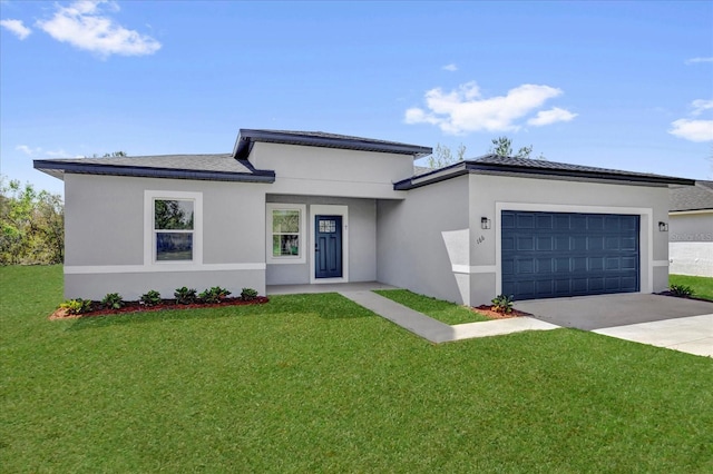 prairie-style home with stucco siding, a front lawn, concrete driveway, and an attached garage