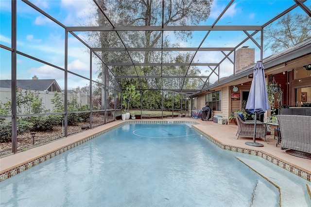 outdoor pool featuring a patio and a lanai