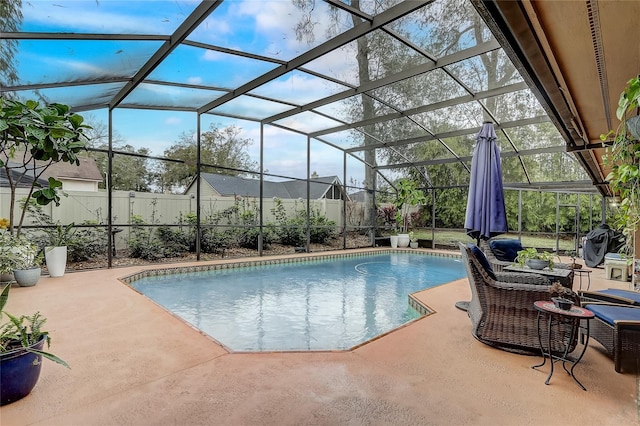 view of swimming pool with a lanai, a fenced backyard, a fenced in pool, and a patio