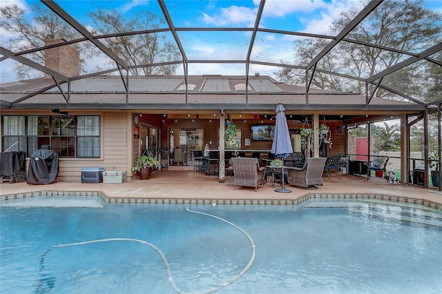 pool with glass enclosure, grilling area, a patio area, and a ceiling fan