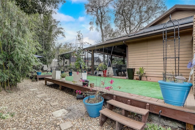 exterior space featuring fence and a lawn