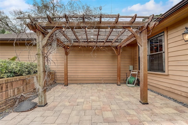 view of patio featuring fence and a pergola