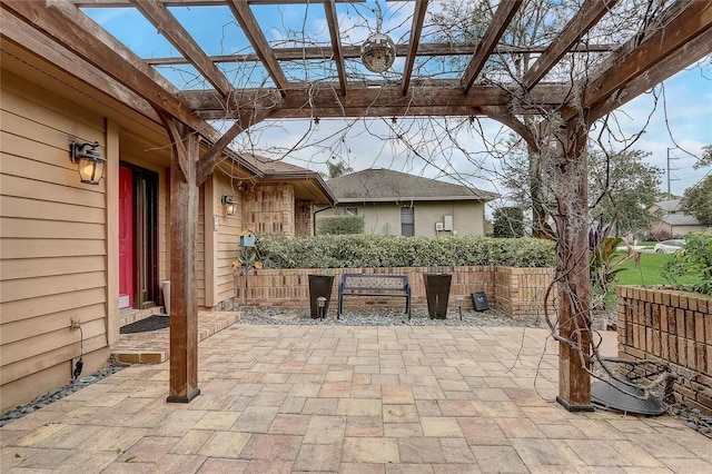 view of patio featuring fence and a pergola