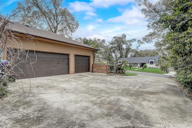 garage featuring driveway