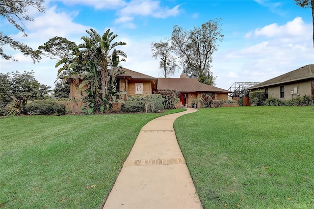 ranch-style home featuring a chimney and a front lawn