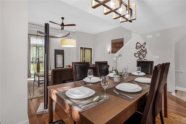 dining room with baseboards and wood finished floors