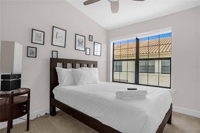 bedroom with light carpet, a ceiling fan, and baseboards