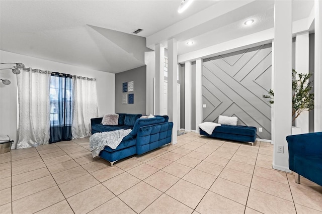 living room with light tile patterned floors and visible vents