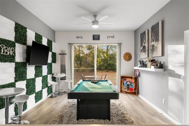 game room with ceiling fan, pool table, light wood-style flooring, and baseboards