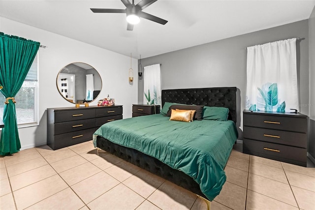 bedroom featuring light tile patterned floors and a ceiling fan