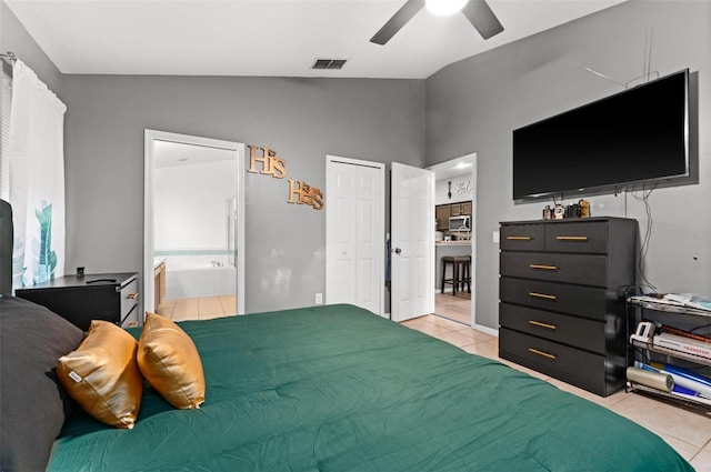 bedroom featuring light tile patterned floors, visible vents, a ceiling fan, connected bathroom, and lofted ceiling