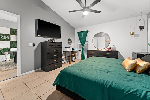 bedroom featuring light tile patterned floors, vaulted ceiling, a ceiling fan, and baseboards