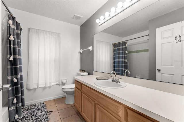 full bath featuring a textured ceiling, tile patterned flooring, toilet, vanity, and visible vents