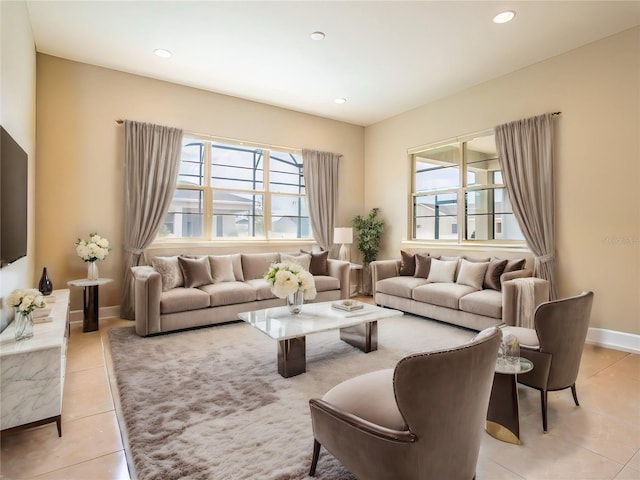 living room featuring recessed lighting, light tile patterned flooring, and baseboards