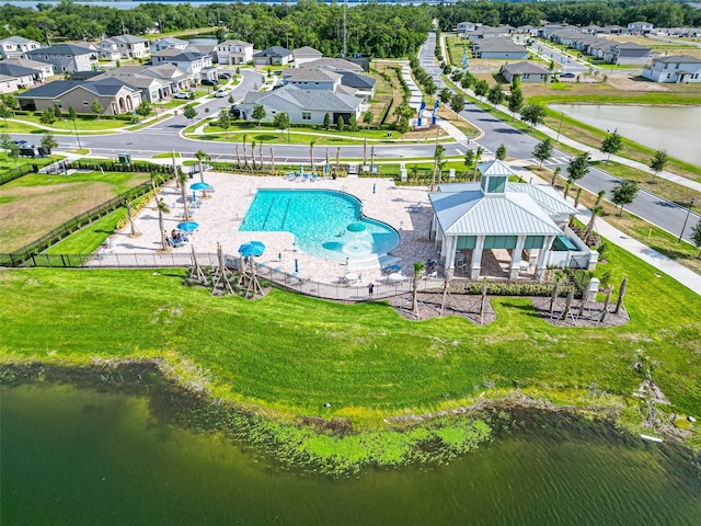 birds eye view of property featuring a residential view and a water view