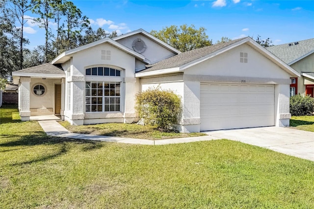 view of front of house with a garage, a front lawn, and stucco siding