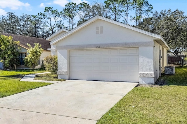 garage with driveway and cooling unit