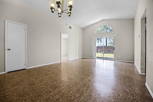 unfurnished room with visible vents, baseboards, lofted ceiling, a textured ceiling, and a notable chandelier