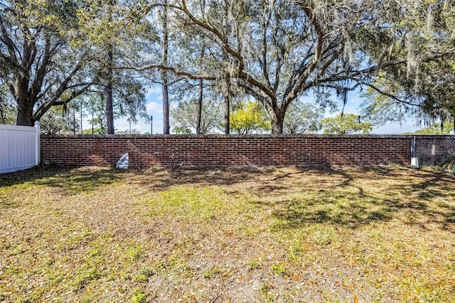 view of yard featuring fence