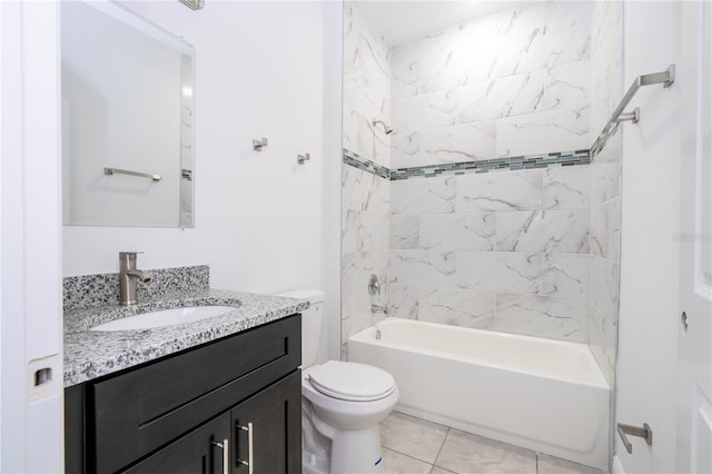 full bath featuring vanity, tile patterned floors, toilet, and washtub / shower combination