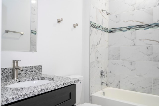 bathroom with shower / bathtub combination, toilet, and vanity